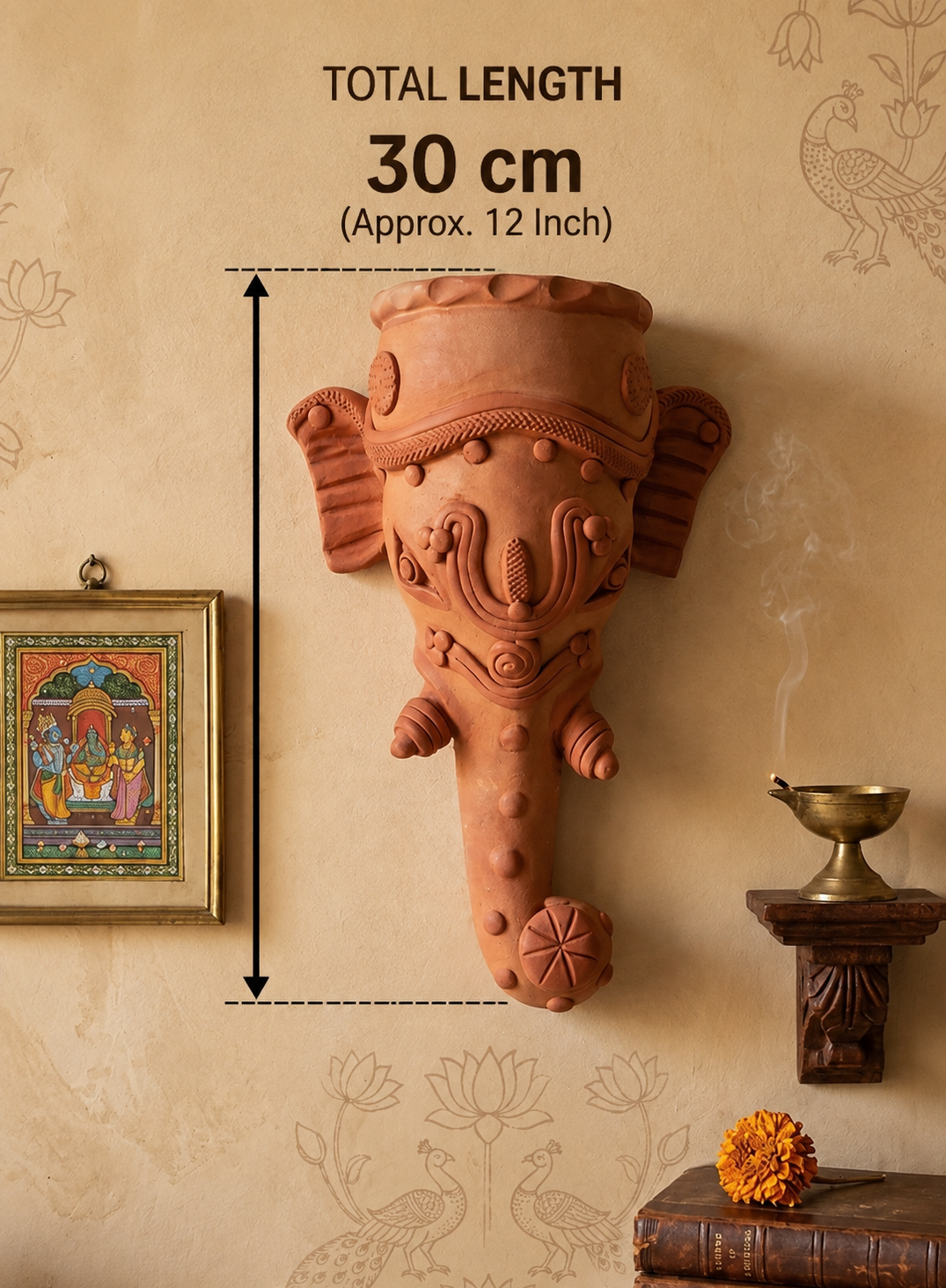 A terracotta-colored elephant head wall sconce mounted on a beige patterned wall, with measurement text indicating a total length of 30 cm (approx. 12 inch).
